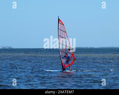 Miami, Florida, United States - April 13, 2024: Windsurfer in Biscayne Bay by Matheson Hammock Park. Only for editorial use. Stock Photo