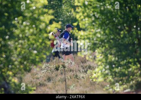 Thursley Common, Godalming. 08th June 2024. A sunny start to the day for the Home Counties. People enjoying the weather at Thursley Common near Godalming in Surrey. Credit: james jagger/Alamy Live News Stock Photo