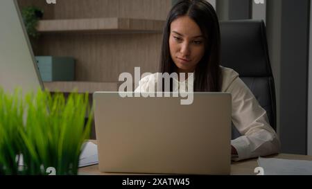 Caucasian analyst financial specialist busy business girl office worker manager entrepreneur female at workplace businesswoman woman writing notes Stock Photo