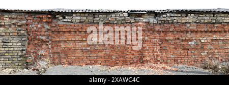 Very old destroyed fence made of red bricks. Isolated on white Stock Photo