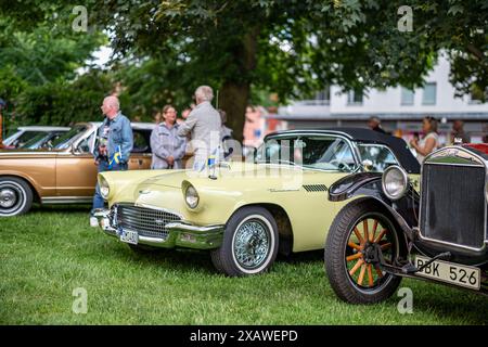 Yellow Ford Thunderbird 1957 at Swedish National day celebration in the Olai Park. This day coincides with the Motor historic day in Sweden Stock Photo