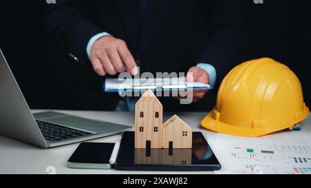 Construction planning, Structural calculation, Construction cost planning, Project presentation plan, Architect or engineer using tablet to work on ta Stock Photo
