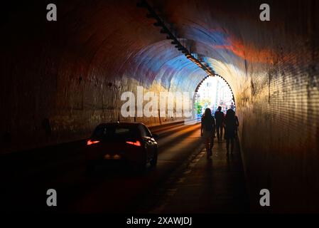 Car and people in the tunnel Stock Photo