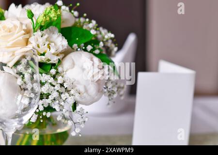 Close up of white flower bouquet at wedding table Stock Photo
