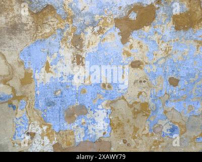 Peeling paint on wall. Scratched painted surface. colorful grunge cracked paint wall background. layers of paint weathered concrete textures. Old weat Stock Photo
