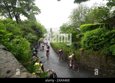 Riders heading up The Rake hill climb in Ramsbottom during stage four ...