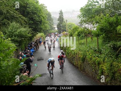 Riders heading up The Rake hill climb in Ramsbottom during stage four ...