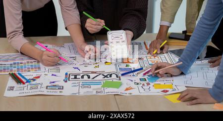 collaboration UX Developer and UI Designer Brainstorming Session with Creative Sketches and Prototypes on a Table Stock Photo