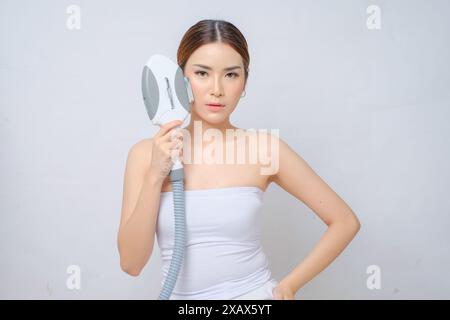 Brightening Asian Beauty Skin with Laser IPL (Intense Pulsed Light) isolated white background Stock Photo