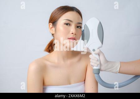 Laser IPL (Intense Pulsed Light) Skin Rejuvenation for Asian Woman isolated white background Stock Photo