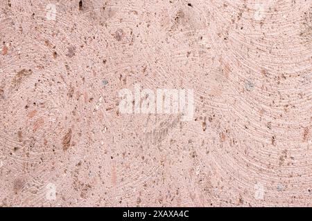polished texture of pink brown armenian tuff wall tile Stock Photo