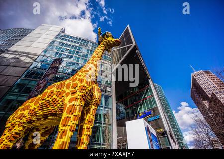 giant giraffe built with Lego pieces, Potsdamer Platz buildings, Berlin, germany, europe Stock Photo