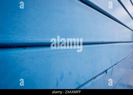 close up of a blue metal shutter door with shallow depth of field Stock Photo