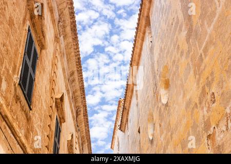 Historic architecture against the background of a beautiful sky with picturesque clouds, Geometric lines, close-up of details, Mediterranean style Stock Photo
