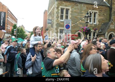 Northampton Saints Rugby team winners celebrating the premiership win in town centre  crowds of people cup winners win Town hall outside on a bus tour Stock Photo