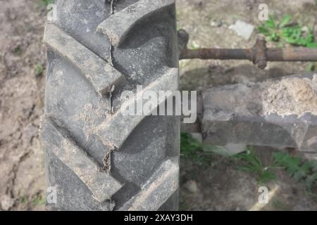 Close up photo of a tractor tire tread, selective focus. Stock Photo