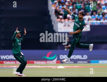 Eisenhower Park, United States. 09th June, 2024. Pakistan's Haris Rauf (R) celebrates with teammate Babar Azam (L) after the dismissal of India's Ravindra Jadeja in the India vs. Pakistan match in Group A at the ICC Men's T20 World Cup 2024 at Nassau County International Cricket Stadium at Eisenhower Park on Sunday, June 9, 2024 in New York. The ICC Men's T20 World Cup 2024 winners will receive the highest amount in the tournament's history. Photo by John Angelillo/UPI Credit: UPI/Alamy Live News Stock Photo