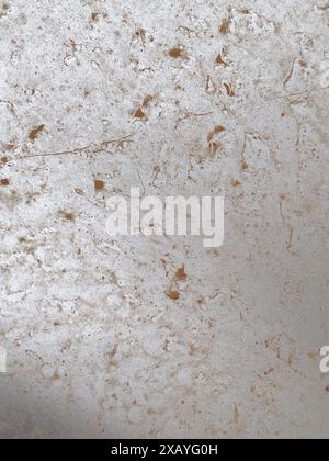 Cremona, Italy - June 9th 2024  Silver car parked on a city street is covered in a thick layer of dust after a sandstorm Stock Photo