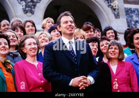 The new Labour Prime Minister, Tony Blair, surrounded by some of the 101 new female Labour MPs following Labour's victory in the 1997 general election. Church House, Westminster, London, UK.  7 May 1997 Stock Photo