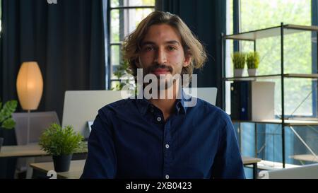Arabian middle eastern ethnic man businessman programmer software coder office worker executive manager employer entrepreneur working with laptop Stock Photo