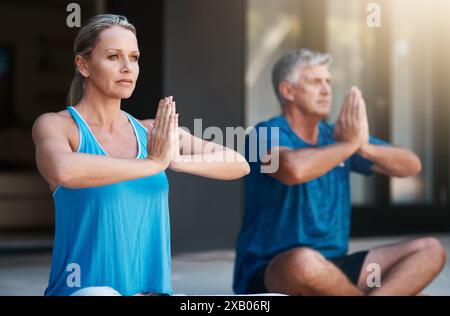 Yoga, hands and mat for couple in meditation, zen and peace for wellness, relax and healthy with mindset. Floor, yogi and pilates for spiritual Stock Photo