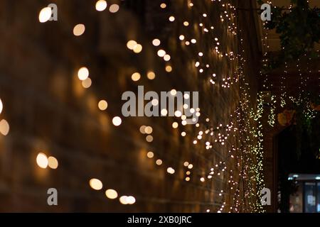 Blurred bokeh lights on yellow background Stock Photo