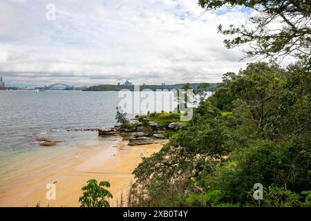 Milk Beach in Vaucluse Sydney, view across Sydney harbour to Sydney harbour bridge, NSW,Australia Stock Photo