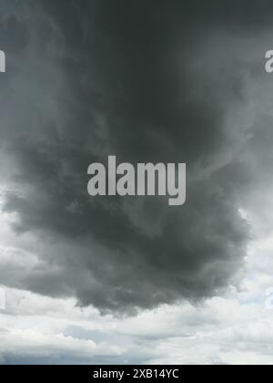 Cumulonimbus cloud formations on tropical sky , Nimbus moving , Abstract background from natural phenomenon and gray clouds hunk , Thailand Stock Photo