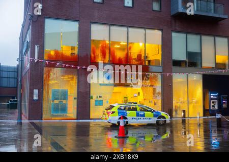 Bury, UK. 10 JUN, 2024. Direct action group target Bury branch of Barclays bank on Central Street. The direct action group have targeted other branches in recent weeks and on this occasion smashed windows and sprayed the building with red paint as well as caused damage to ATM machines. Credit Milo Chandler/Alamy Live News Stock Photo