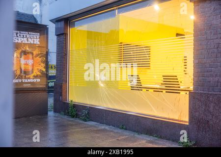 Stockport, UK. 10 JUN, 2024. Direct action group target Stockport branch of Barclays bank on Bridge Street. The direct action group have targeted other branches in recent weeks and on this occasion smashed windows and sprayed the building with red paint. Credit Milo Chandler/Alamy Live News Stock Photo