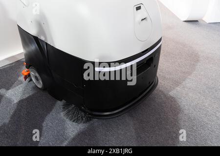 Industrial robot vacuum cleaner at work Stock Photo