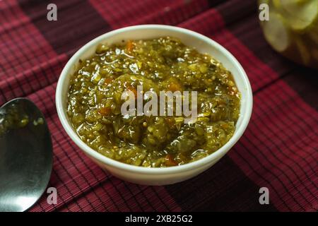 sweet pickle relish in a white bowl, coarse chop of cucumber, pepper and onion with sweet vinegar brine Stock Photo