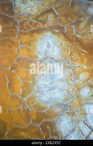 Stunning natural abstract patterns with a golden crackled texture photographed in Riotinto, Huelva, Spain Ideal for backgrounds or artistic designs Stock Photo