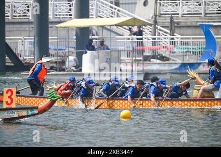 (240610) -- TIANJIN, June 10, 2024 (Xinhua) -- Laura Mora, a Spanish engineer from Airbus China, and her teammate compete during the 2024 Haihe Dragon Boat Race in north China's Tianjin on June 10, 2024. On the day of the Dragon Boat Festival, Laura Mora finished her dragon boat race in the 2024 Haihe Dragon Boat Race for the first time. Born in coastal city Cadiz, the spanish engineer is familiar with many water sports, but the dragon boat race with a long history stays fresh to her. 'Participating in Dragon Boat races is not just for Dragon Boat Festival entertainment to me, but also a good Stock Photo