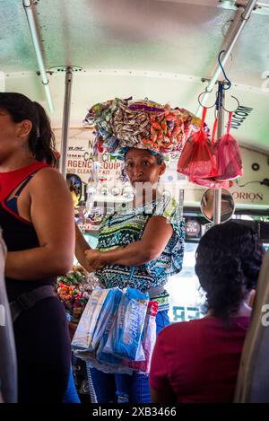 Woman food seller on a chicken bus, La Libertad, El Salvador Stock Photo