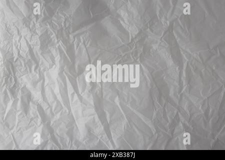 White wrinkled wrapping paper background. Thin subtle paper texture. Grunge backdrop. Stock Photo