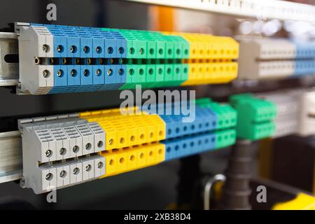 New terminal blocks located on a DIN rail at the exhibition stand Stock Photo