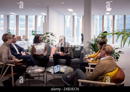 Multiracial male and female business professionals discussing in meeting at office Stock Photo