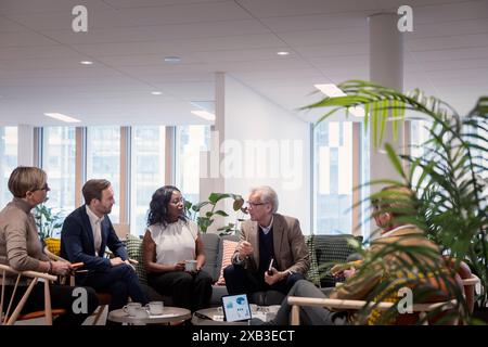 Multiracial business colleagues discussing in meeting at office Stock Photo