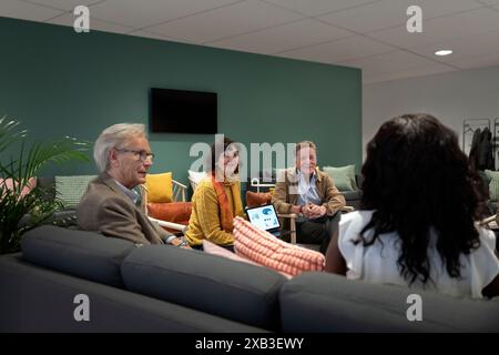 Multiracial business professionals discussing in meeting at office Stock Photo