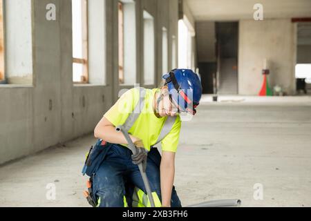 Female engineer with equipment working at construction site Stock Photo