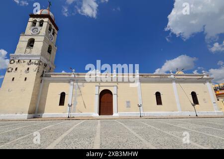 376 SE facade of the Holy Savior Cathedral Church over the National Anthem Square, colonial-style building from 1740 re-erected in 1919. Bayamo-Cuba. Stock Photo