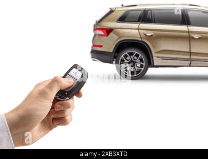 Male hand unlocking a SUV with a remote key isolated on white background Stock Photo