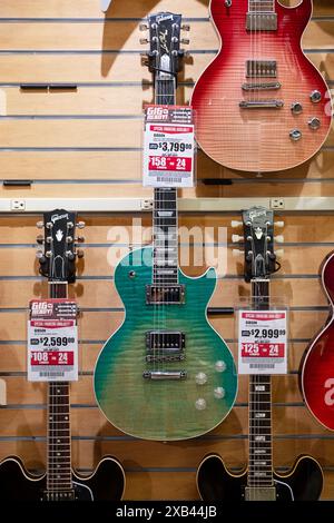 A Gibson Les Paul guitar with a seafoam  face for sale for $3799 at Sam Ash in Manhattan, New York City. It's a reduced price. Stock Photo