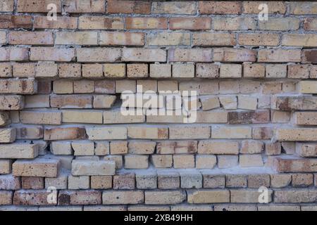 White brick building structure with missing bricks full frame Stock Photo