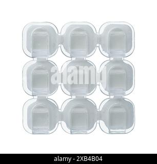 Front view of self-adhesive transparent plastic cable hooks clips isolated on white Stock Photo