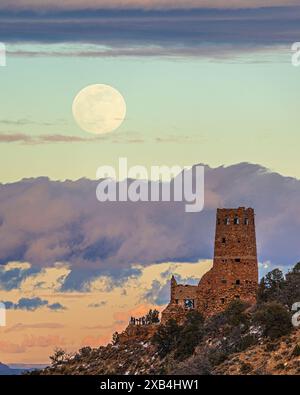 Winter moon rising over the Desert View Watchtower in Grand Canyon National Park, Arizona Stock Photo