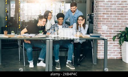Group of People Sitting Around a Table in an Office Stock Photo