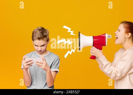 Gadget addicted boy playing mobile games on cellphone Stock Photo