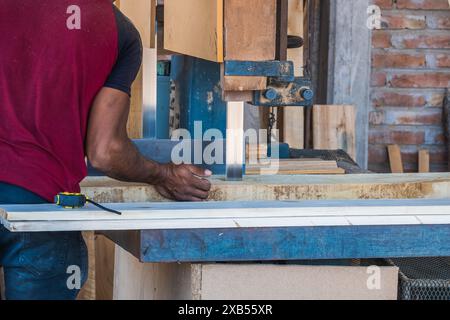Carpenters using circular saw in workshop Stock Photo